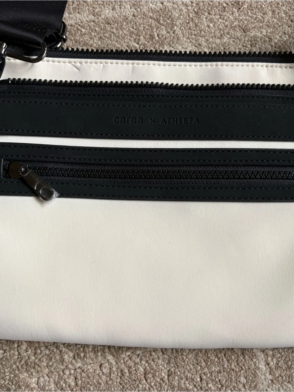 white and black Caraa x Athleta crossbody bag